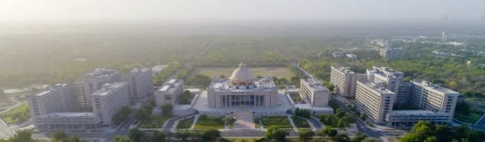 Wide aerial view of an institutional campus and its grounds