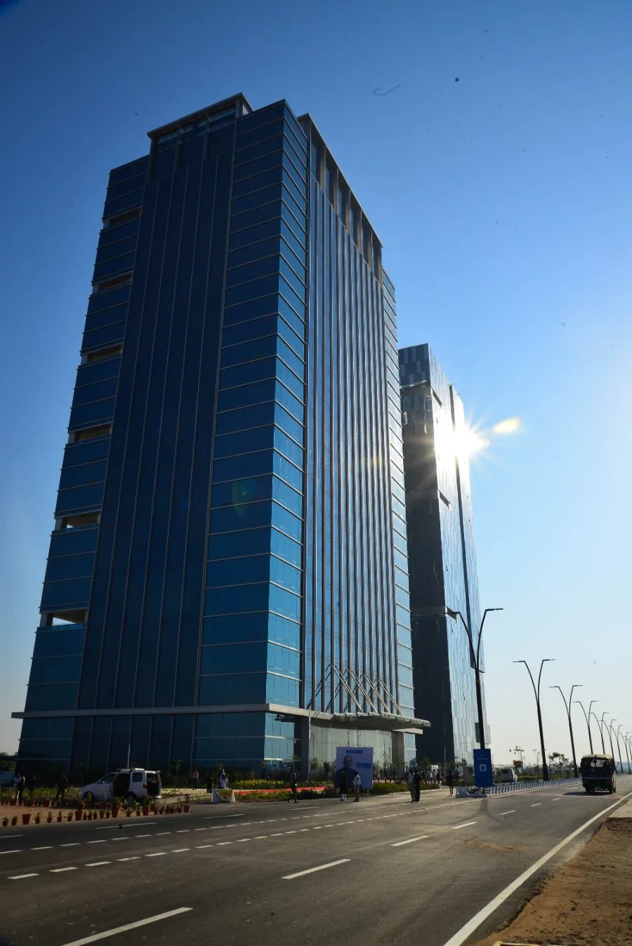 Glass corporate office tower photographed from street level for an architectural commission