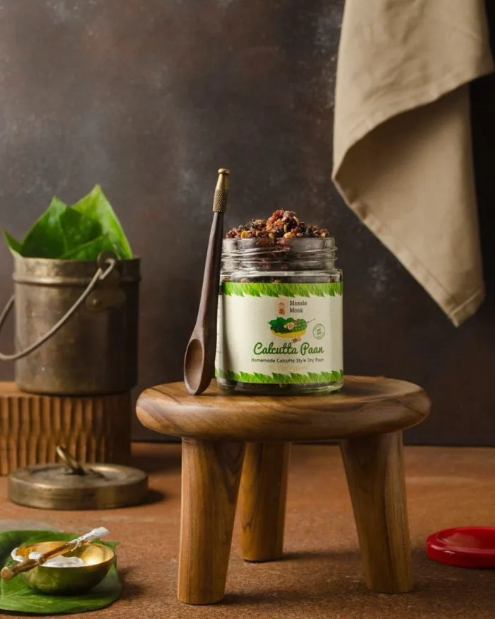Styled product photograph of a preserve jar on a wooden stool