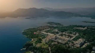 Aerial view of a lakeside destination-wedding town at dawn
