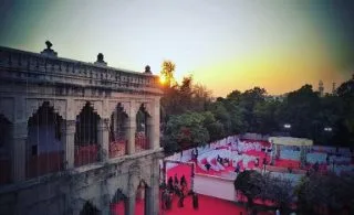 Outdoor wedding set up in a heritage courtyard at sunset